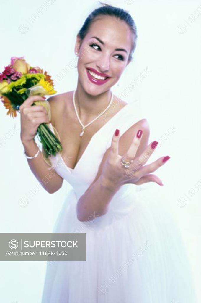 Stock Photo: 1189R-4050 Young bride smiling showing her wedding ring