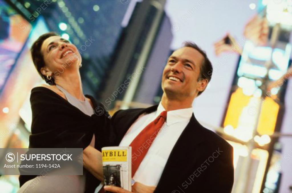 Stock Photo: 1194-142A Low angle view of a mid adult couple smiling