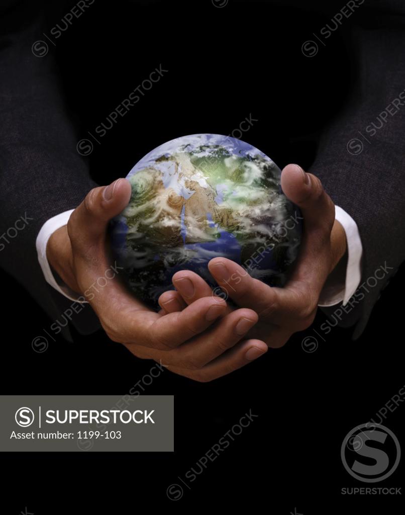 Stock Photo: 1199-103 Businessman holding a globe