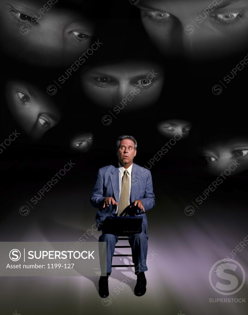 Stock Photo: 1199-127 Eyes watching a businessman