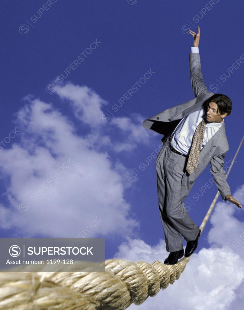 Stock Photo: 1199-128 Businessman walking a tightrope
