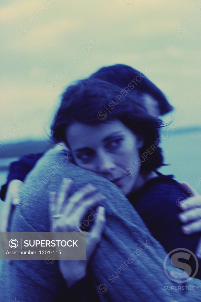 Stock Photo: 1201-115 Mid adult couple embracing each other