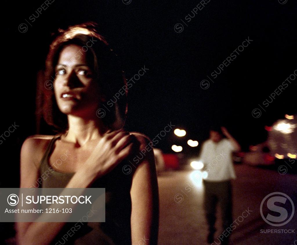 Stock Photo: 1216-103 Young man stalking a young woman