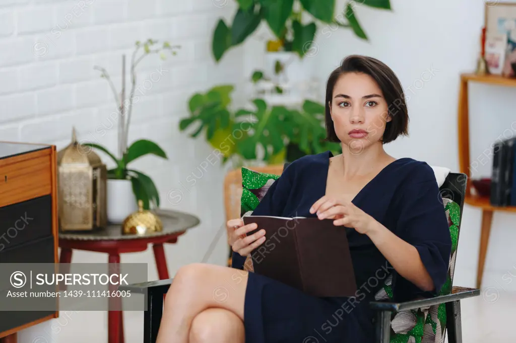 Businesswoman preparing paperwork in office