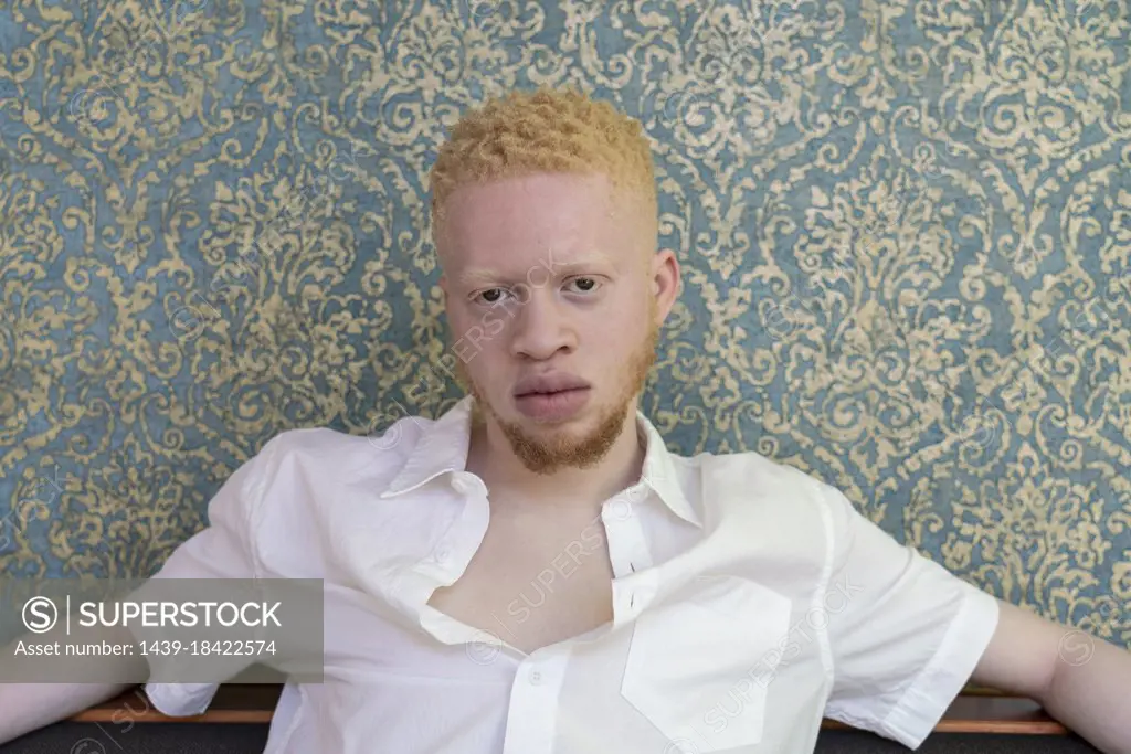 Germany, Cologne, Portrait of albino man in white shirt