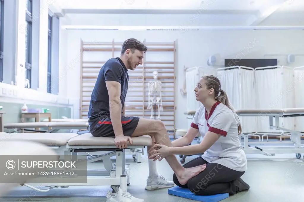 Physiotherapist with patient in hospital
