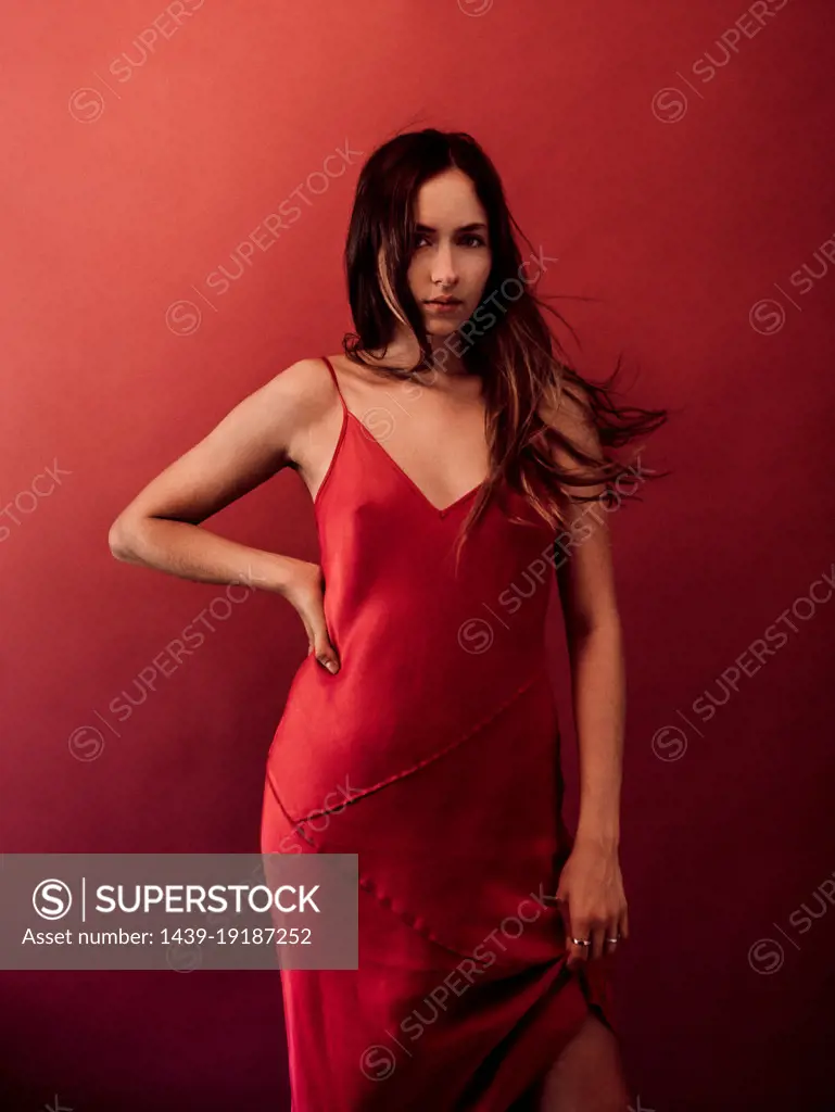Studio portrait of woman in red dress