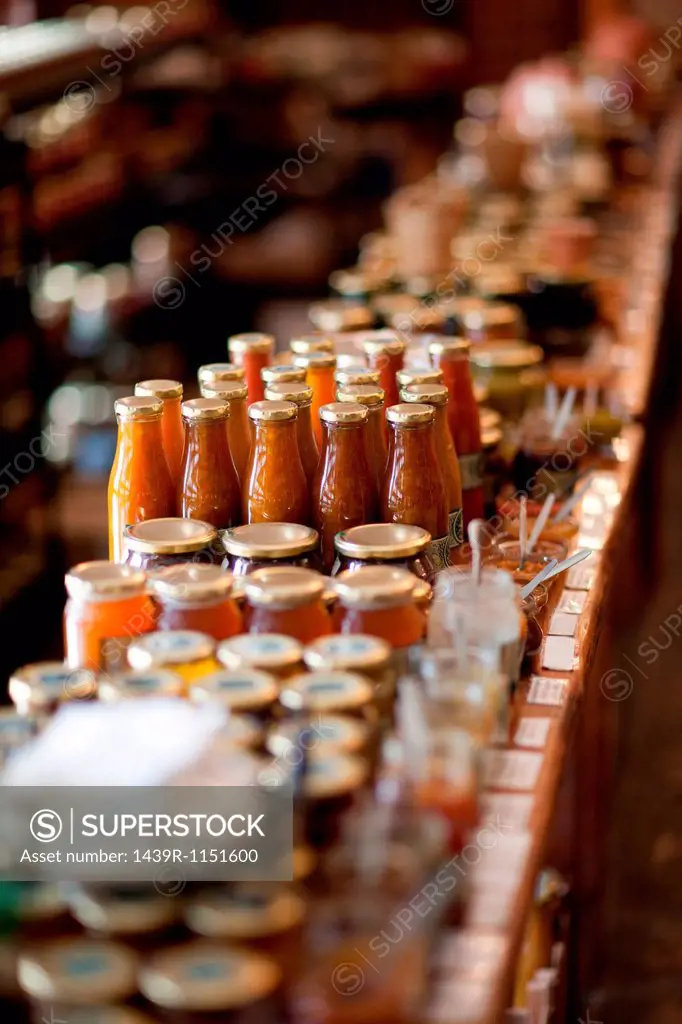 Jars of preserves and sauce in grocery