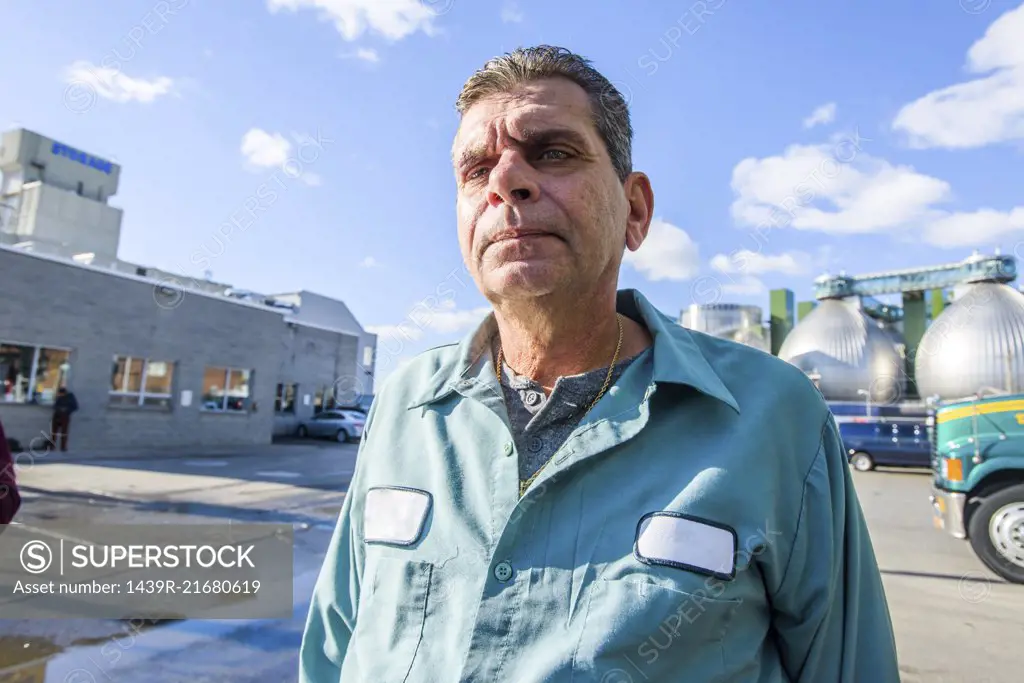 Portrait of male worker at biofuel industrial plant