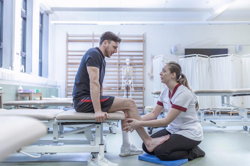 Physiotherapist with patient in hospital