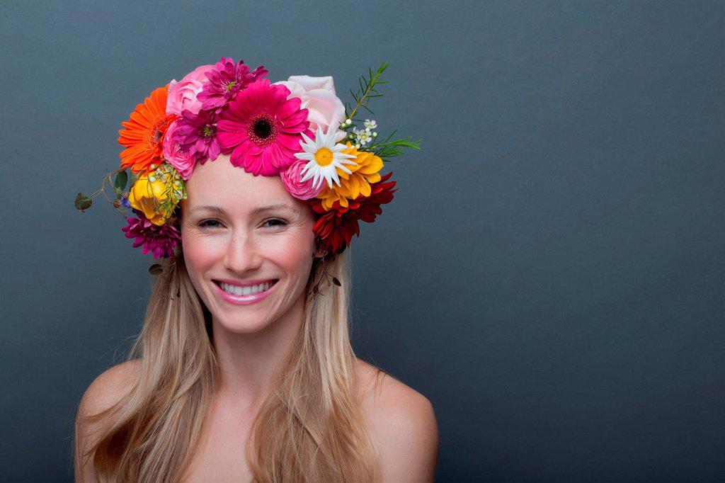 Young woman wearing garland of flowers on head