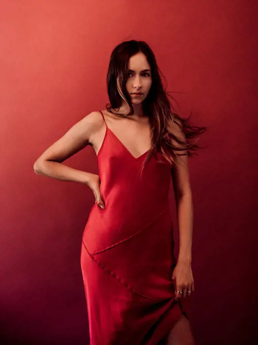 Studio portrait of woman in red dress