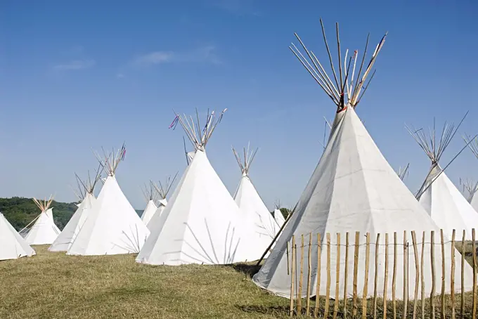 Teepees in a field