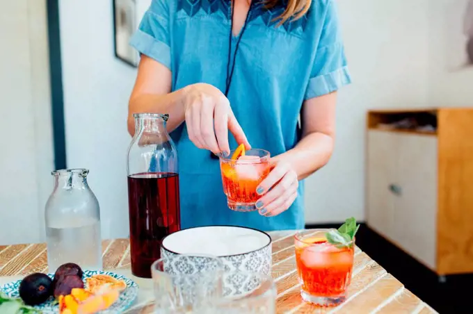 Woman preparing cocktail