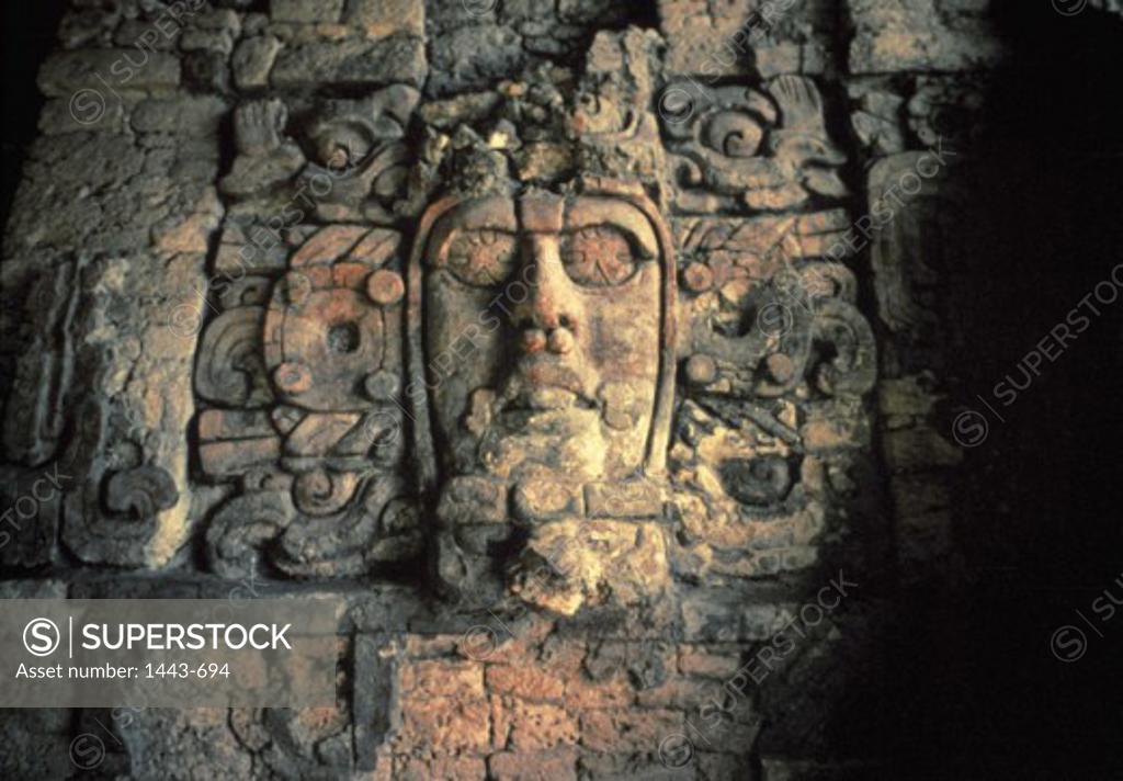 Stock Photo: 1443-694 Close-up of a human face carved on a wall, Temple of the Masks, Kohunlich, Quintana Roo, Mexico