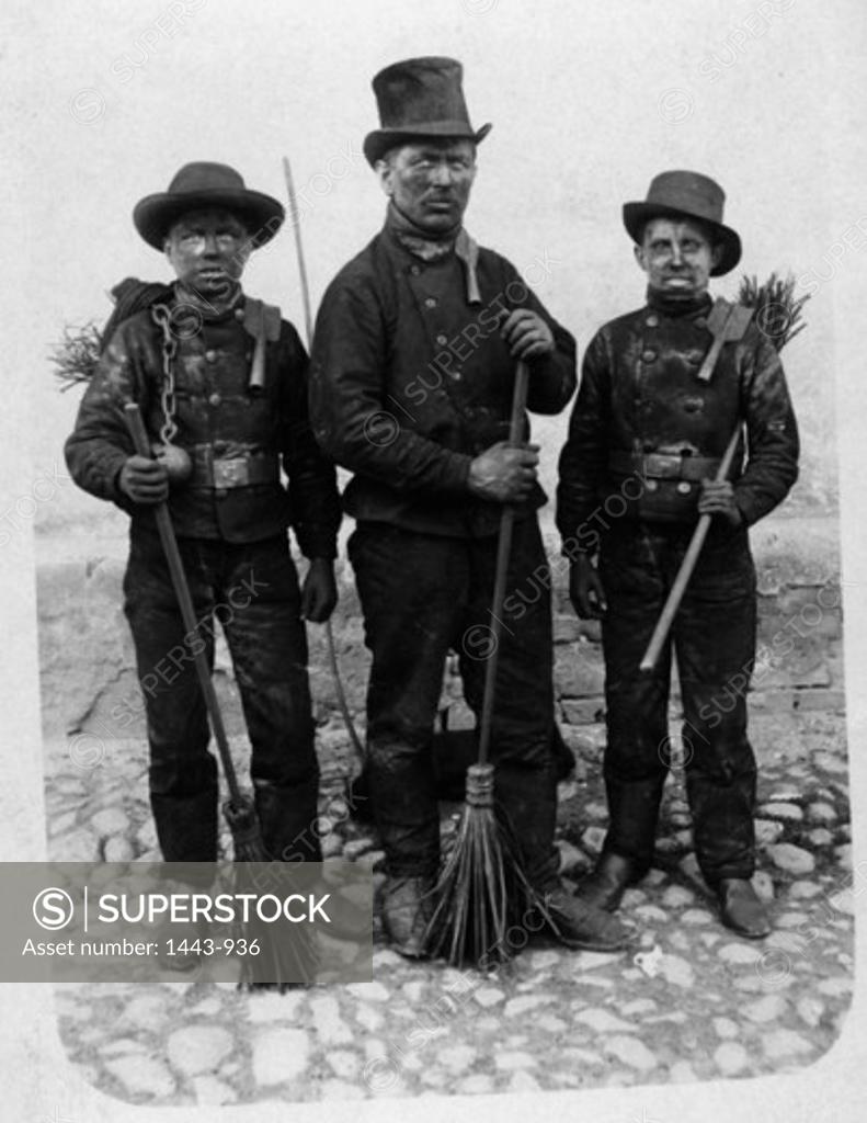 Stock Photo: 1443-936 Portrait of three chimney sweeps standing together, 1915