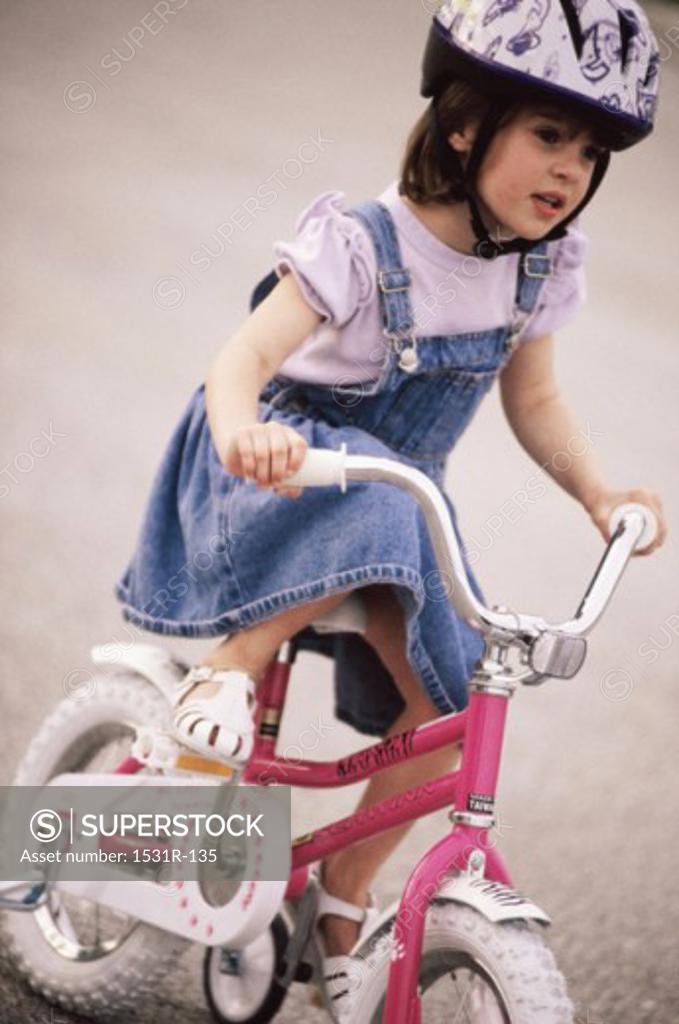 Stock Photo: 1531R-135 Girl riding a bicycle