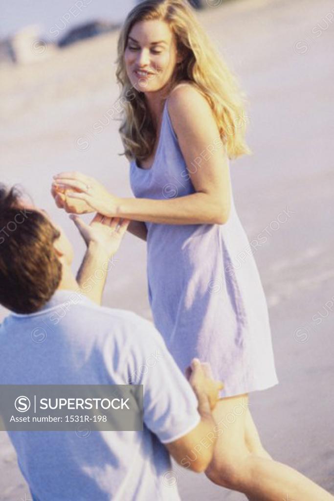 Stock Photo: 1531R-198 Young couple together at the beach
