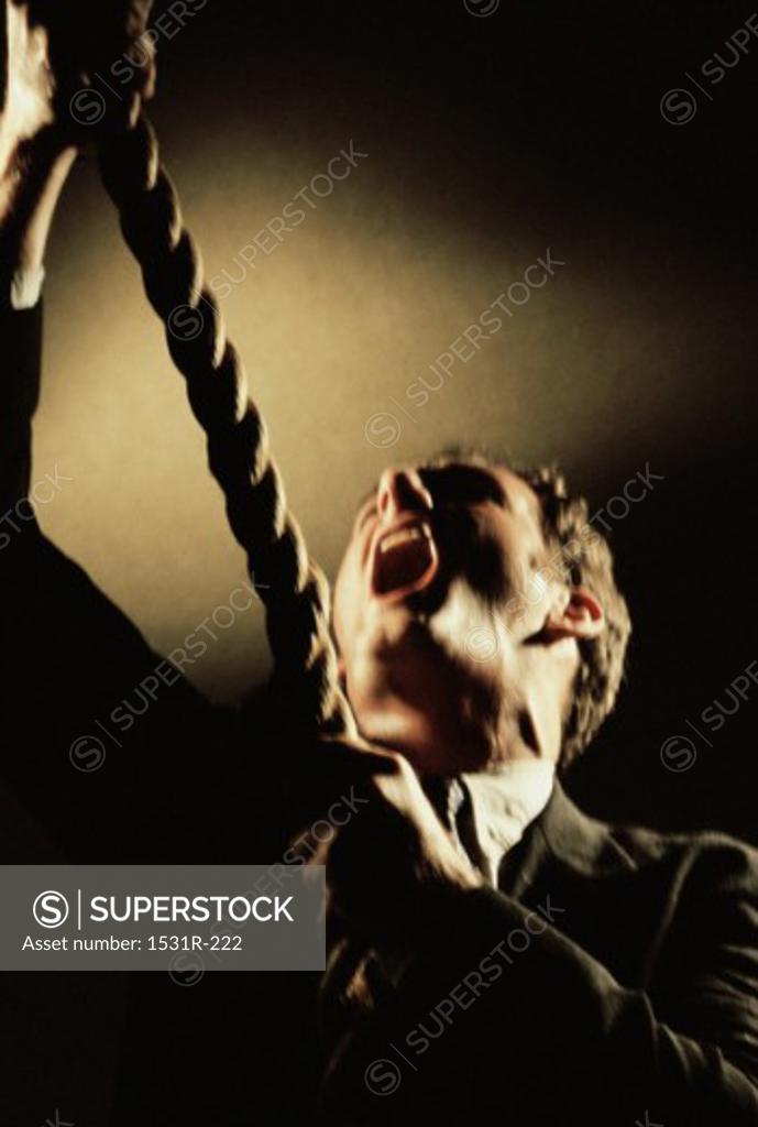 Stock Photo: 1531R-222 Businessman hanging himself with a rope