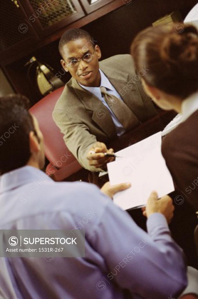 Stock Photo: 1531R-267 Three business executives in a meeting