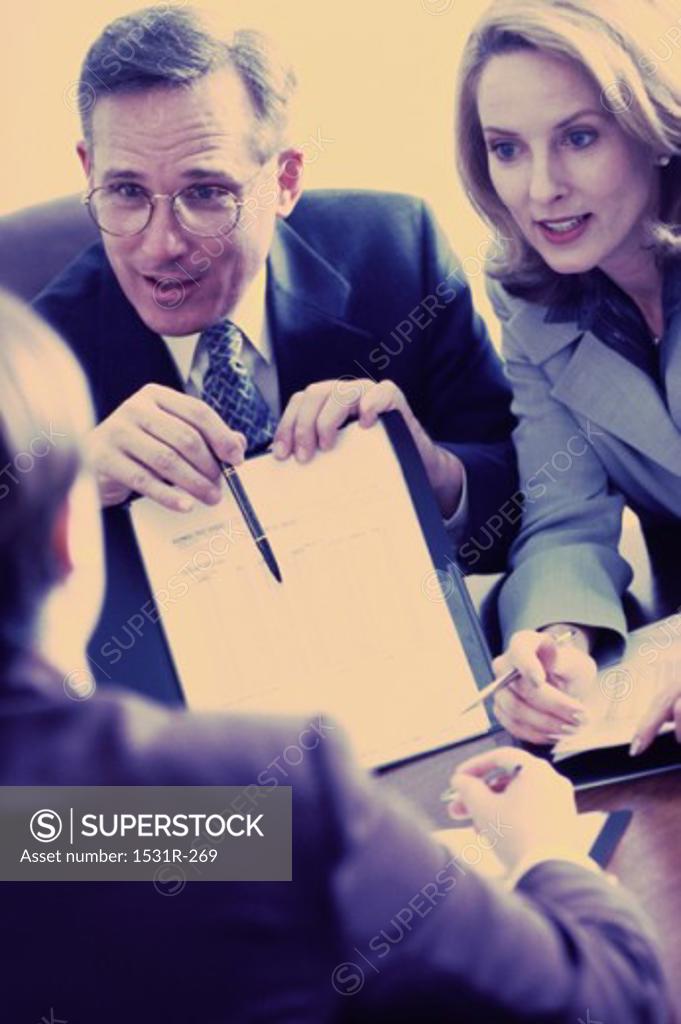 Stock Photo: 1531R-269 Three business executives in a meeting