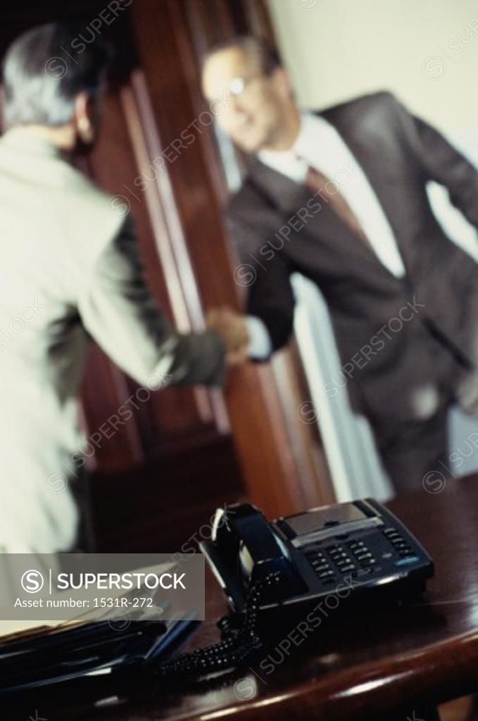 Stock Photo: 1531R-272 Two businessmen shaking hands