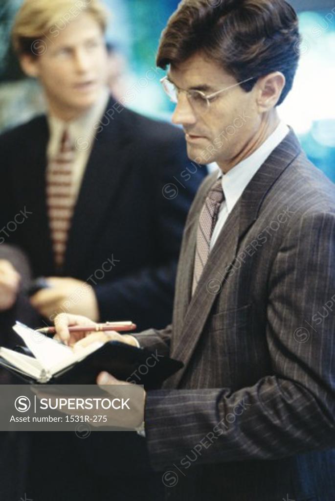 Stock Photo: 1531R-275 Two businessmen in an office