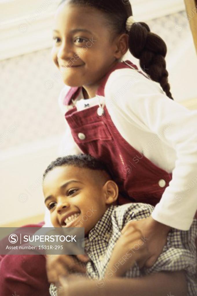 Stock Photo: 1531R-295 Girl and a boy playing