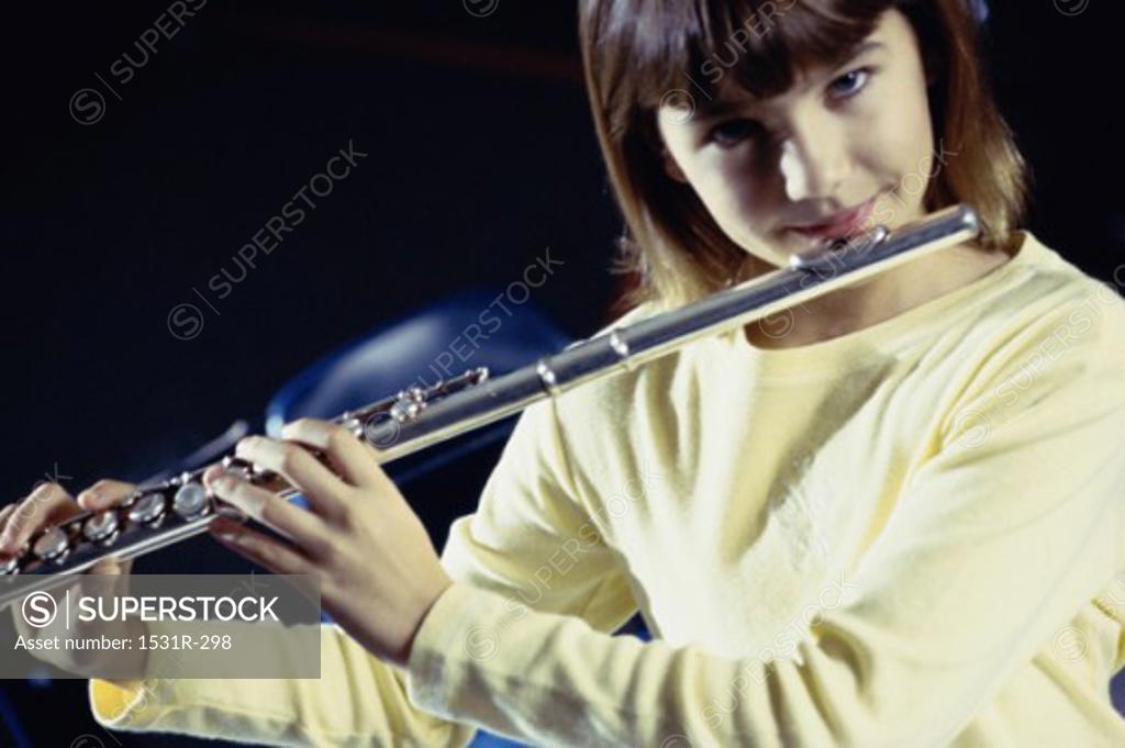 Stock Photo: 1531R-298 Portrait of a girl playing a flute