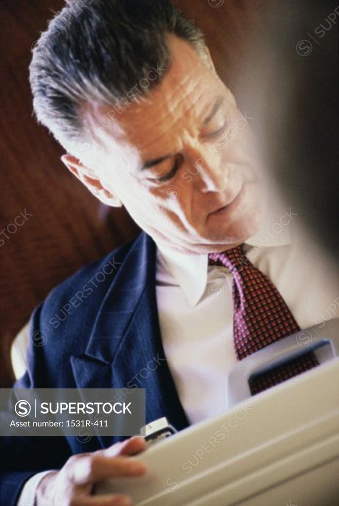 Stock Photo: 1531R-411 Businessman looking down