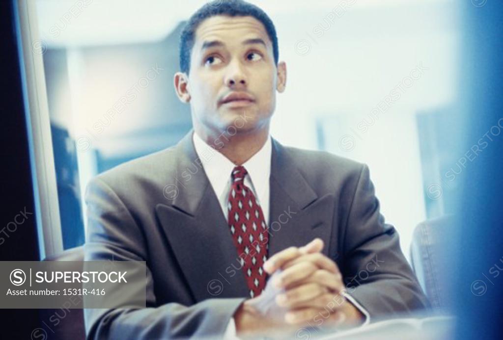 Stock Photo: 1531R-416 Businessman seated at a desk