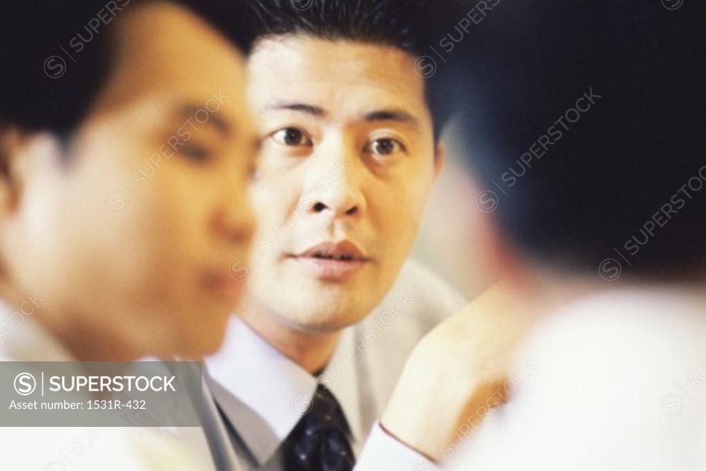 Stock Photo: 1531R-432 Businessmen in a meeting