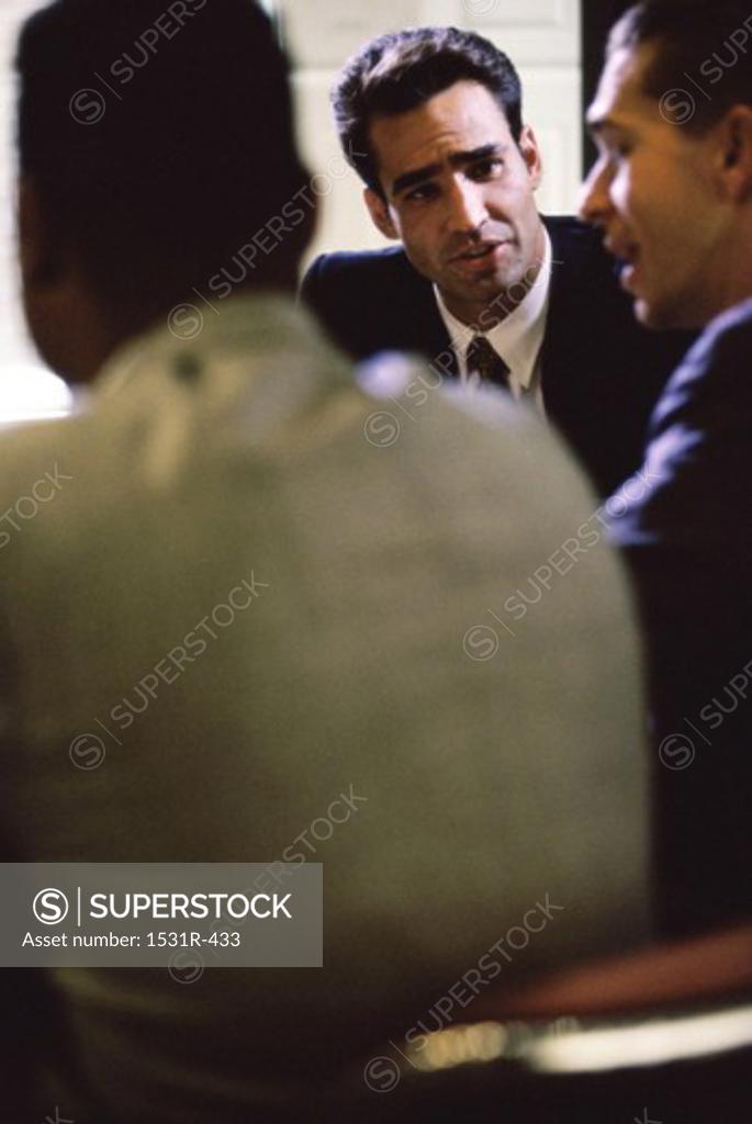 Stock Photo: 1531R-433 Three businessmen together in an office