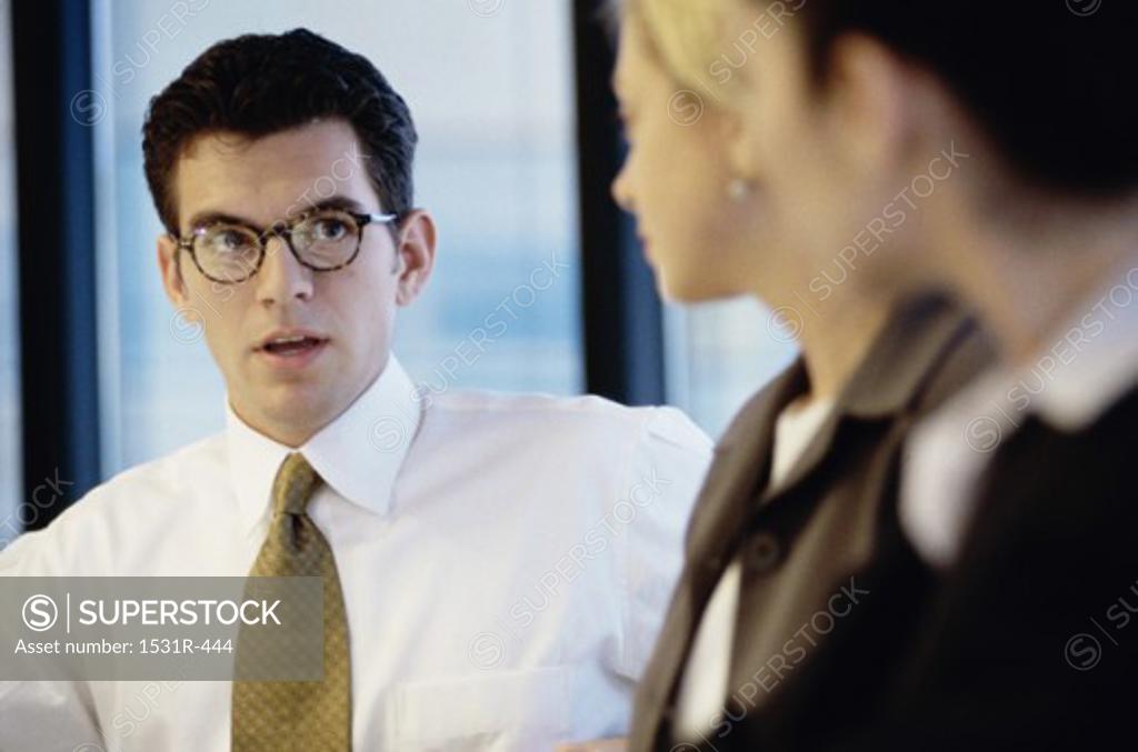 Stock Photo: 1531R-444 Business executives looking at each other