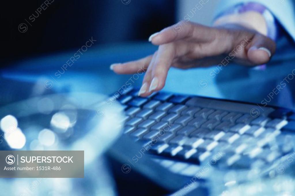 Stock Photo: 1531R-486 Close-up of a person's hand operating a laptop