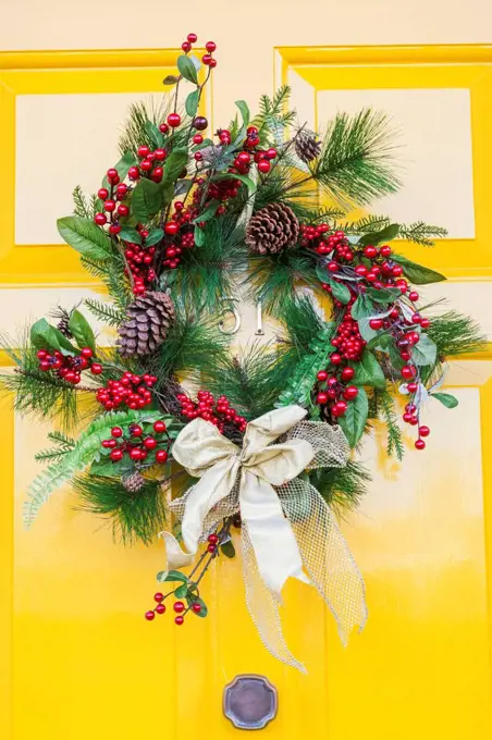 England, London, Southwark, Bankside, Yellow Door with Christmas Wreath