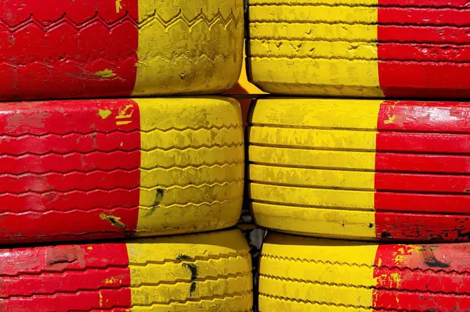 Construction site barrier with yellow and red car tires, Gislaved, Sweden
