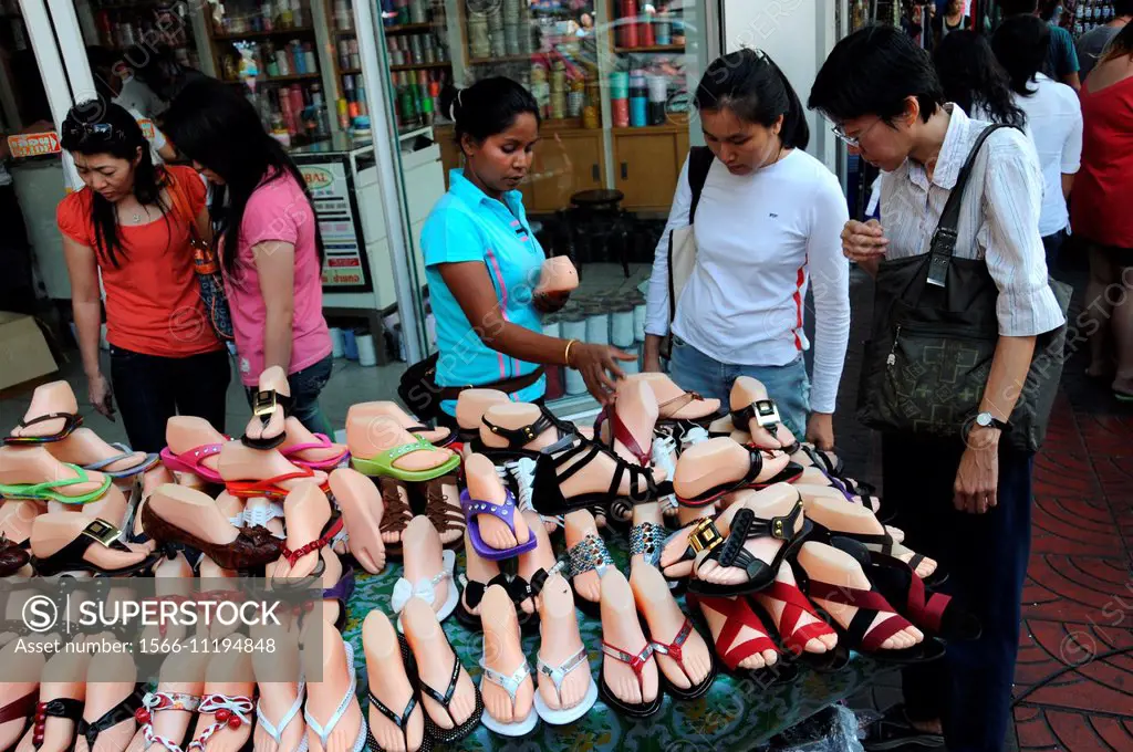 Pattaya Thailand December 16 2017 Flea Market In Thailand People Choose  Things On A Flea Market Many Secondhand Things On The Floor A Lot Of Toed  Shoes With Heels And Different Colors