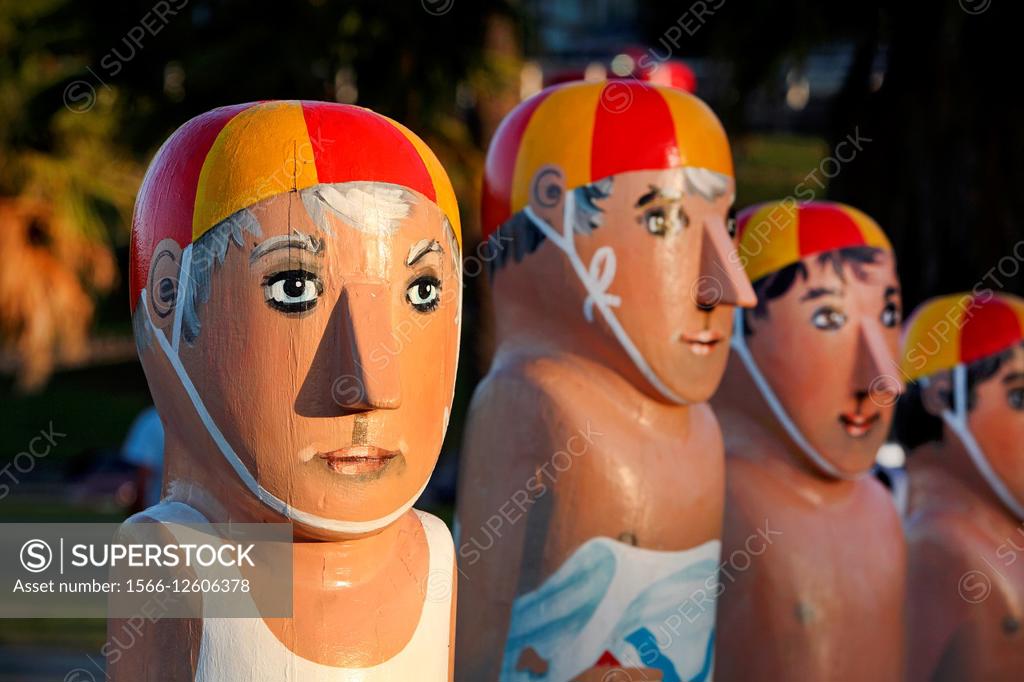 Stock Photo: 1566-12606378 Painted bollards depicting iconic local people and events, by artist Jan Mitchell. Geelong, Victoria, Australia.