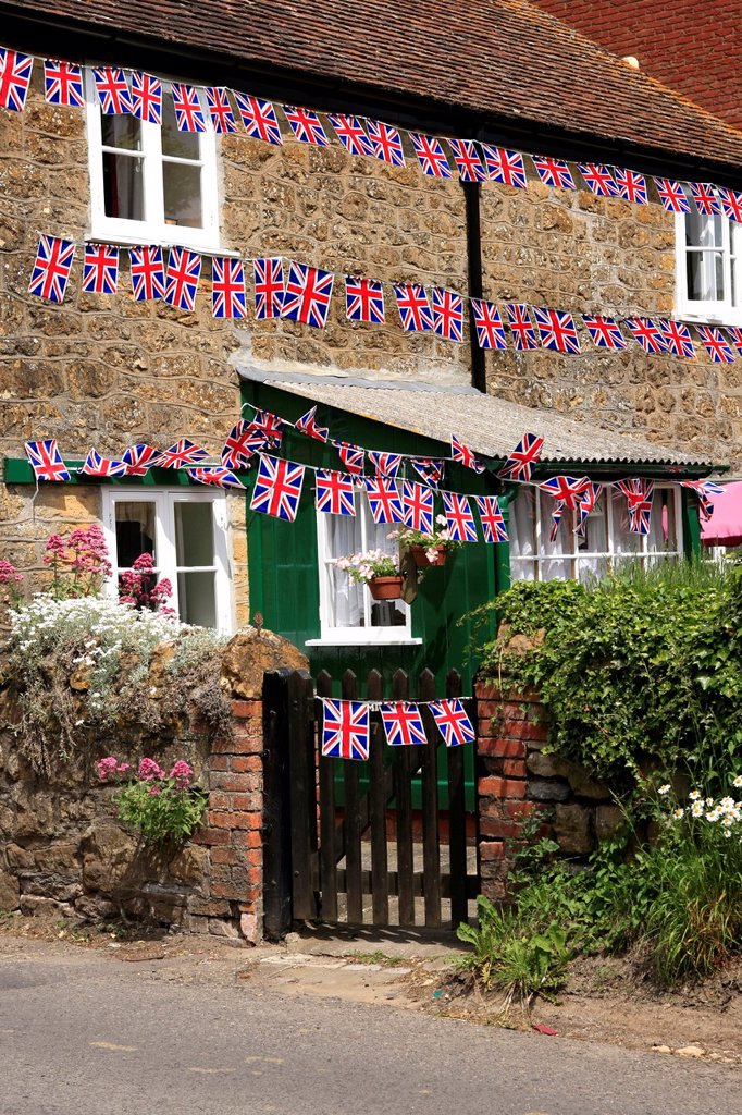 Union Jack flag Bunting bedecks a house in Dorset.