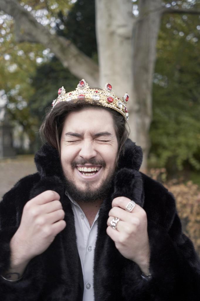 happy man wearing crown
