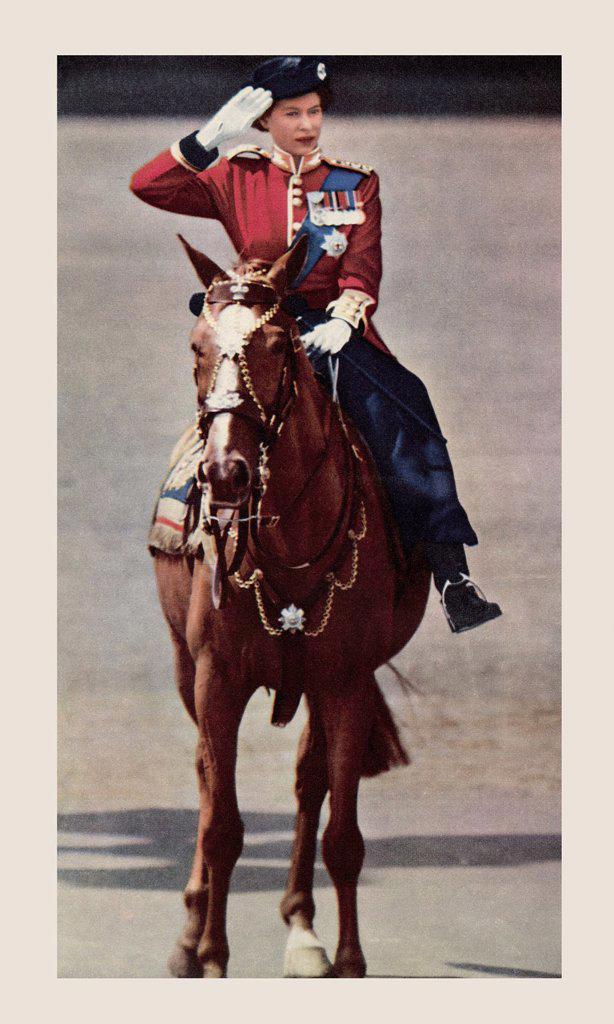 EDITORIAL ONLY Queen Elizabeth taking the salute during the Trooping of the Colour. Elizabeth II, born 1926, Queen of the United Kingdom. From The Que...
