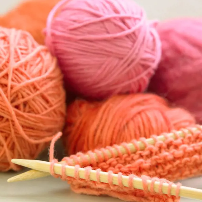Balls of yarn and knit needles