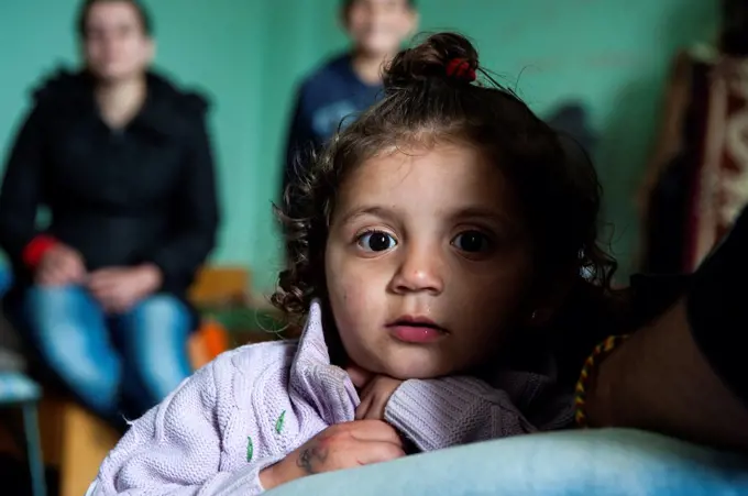 Sofia, Bulgaria, young, Syrian refugee girl, with ehr family living in boredom in refugee camp Vrajdebna.