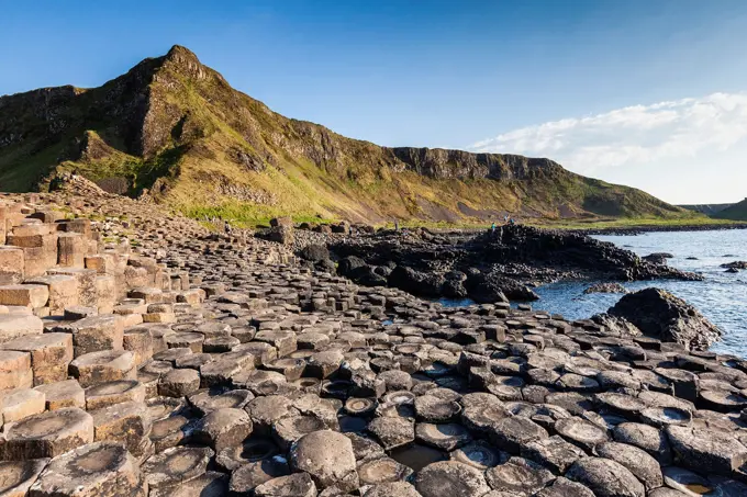 UK, Northern Ireland, County Antrim, Bushmills, Giants Causeway, Unesco World Heritage Site, coastal rock formation of basalt, dusk.