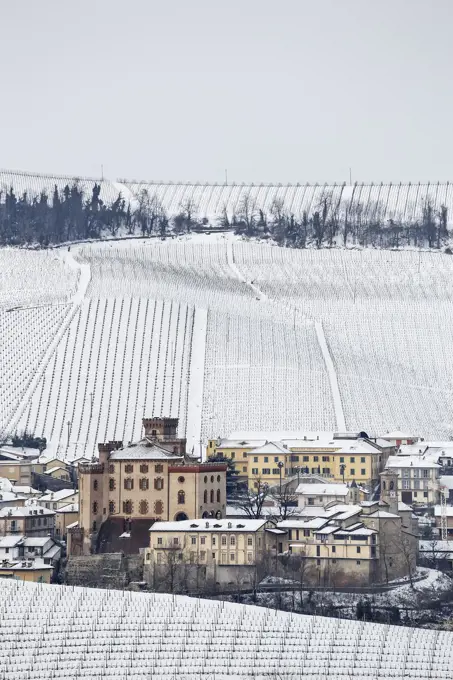 Langhe, Cuneo district, Piedmont, Italy. Langhe wine region winter snow, Barolo castle.