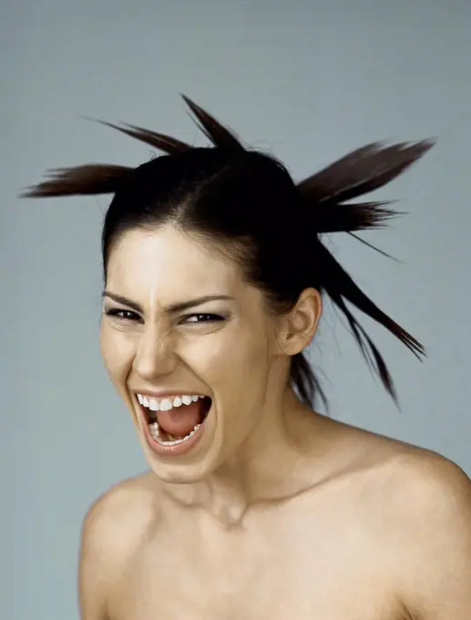 Woman with spiky hairdo, mouth wide open