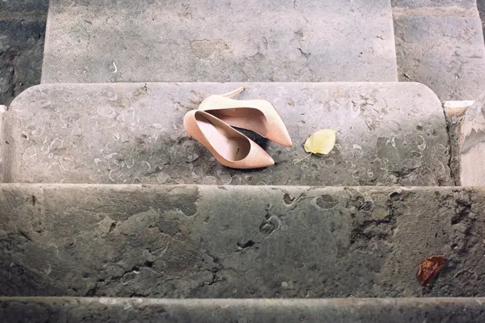 High heel dress shoes left on stairs