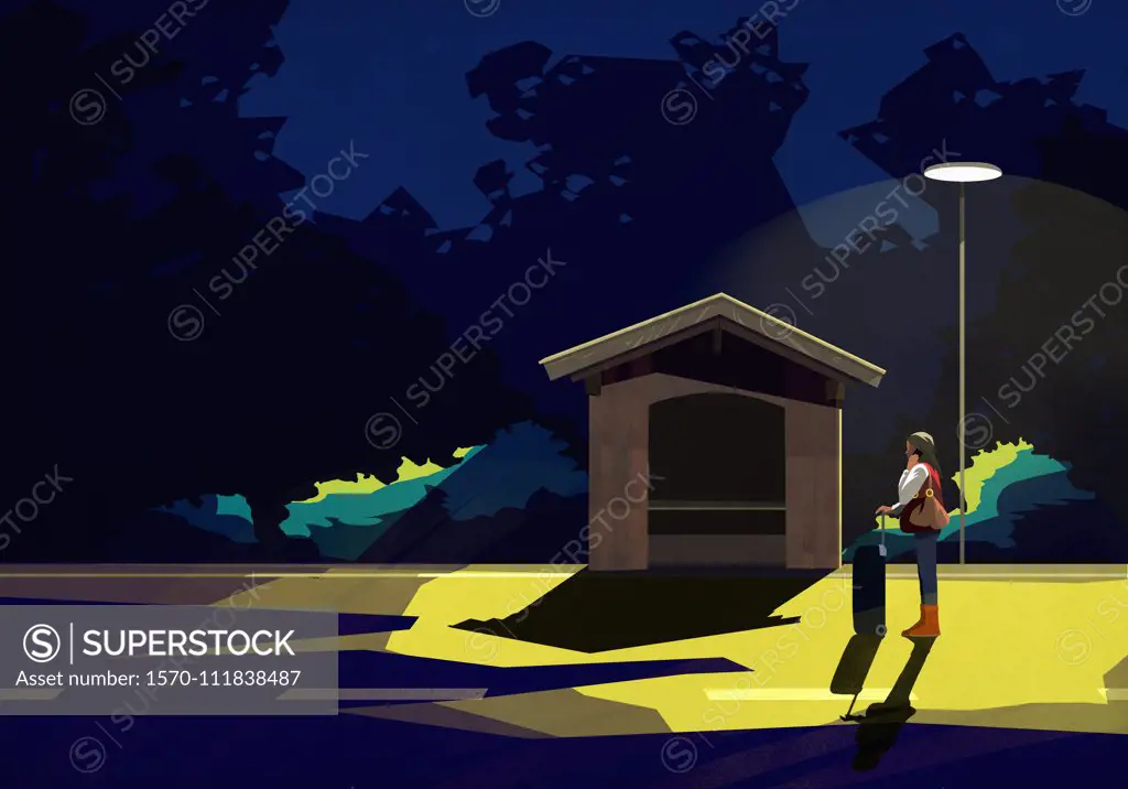 Woman with suitcase waiting under street light at dark bus stop