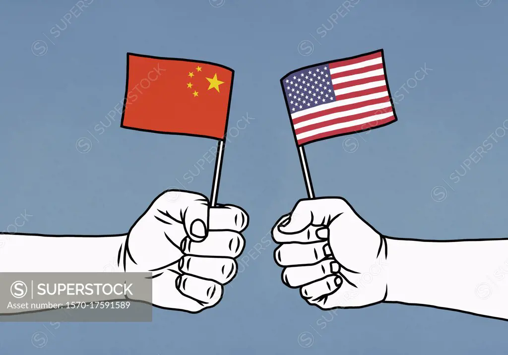 Hands clenching Chinese and American flags on blue background
